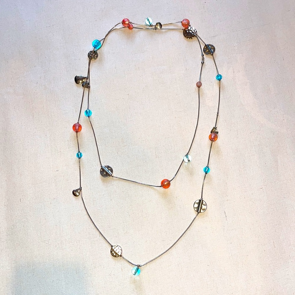 Gold beaded long necklace with blue and coral accents